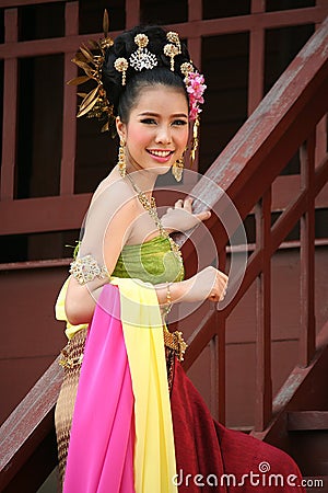 One woman in THAI RETRO DRESS is posing for a photograph. Editorial Stock Photo
